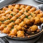 Plated slice of Tater Tot Casserole with ground beef and crispy tots​