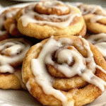 Close macro of spiral cookie crumb and glossy drizzle.