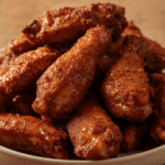 Alt Text: Overhead shot of a party platter featuring Spicy Dry Rub Chicken Wings, garnished with fresh herbs, ideal for Party Appetizers Easy.