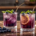 Close up of Blueberry Basil Lemon Lavender Mocktail garnish.