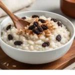 Old School Rice Pudding on a rustic wooden table.