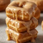 A tray of Brown Butter Maple Donut Bars sliced into rectangles.