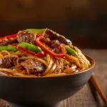 Close-up of Garlic Soy Beef Noodle Stir Fry with broccoli and red peppers