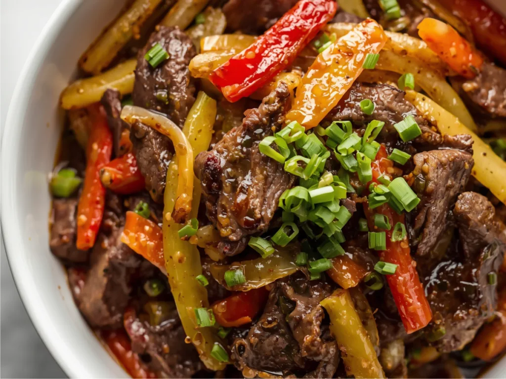 Healthy Asian beef and onion stir fry with green onions