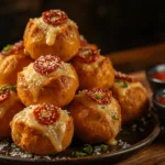 Pizza bombs on a baking sheet.