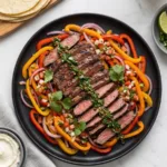 Juicy grilled steak strips and onions