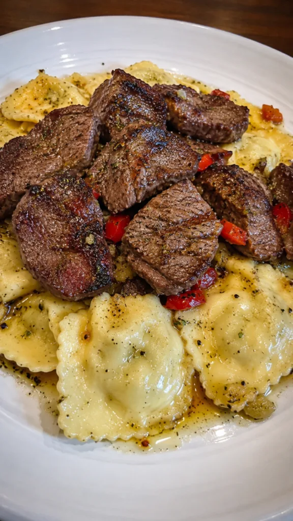 Steak Cuts & Cheese Ravioli in Garlic Butter:Pan-seared steak strips with cheese filled pasta.